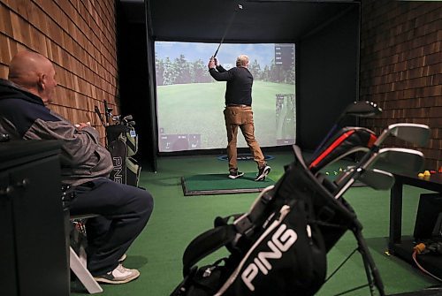RUTH BONNEVILLE / WINNIPEG FREE PRESS

SPORTS - golf simulators

Photos taken at  Rossmere Golf &amp; Country Club, in one of their Golf Simulator booths (Sim Shack). with  Lori Thompson teeing off and his friend, Lorne Jamison looking on.  

Story on the local virtual golf scene in Winnipeg. Is it seeing a boom because of COVID?

Taylor Allen story 

Jan 10th,  2022
