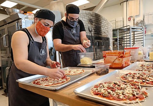 RUTH BONNEVILLE / WINNIPEG FREE PRESS

BIZ - Hildegard&#x2019;s Bakery

Hildegard&#x2019;s Bakery staff make pizzas next to their large stone oven Tuesday.
Supplement photo to use along with photo of David Newsom,co-owner of Hidegard's.  See Story.

At one point, all of Hildegard&#x2019;s Bakery&#x2019;s online restaurant sales were coming through DoorDash, which dramatically decreases its revenue per sale. Newsom wants people to know the shop benefits more when orders come through Hildegard&#x2019;s Bakery&#x2019;s website. 


Jan 11th,  2022
