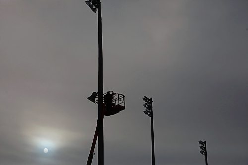 12012021
Corey Ellis with Industry Audio installs new speakers at Andrews Field as the sun shines through cloud cover on a mild Wednesday.  (Tim Smith/The Brandon Sun)