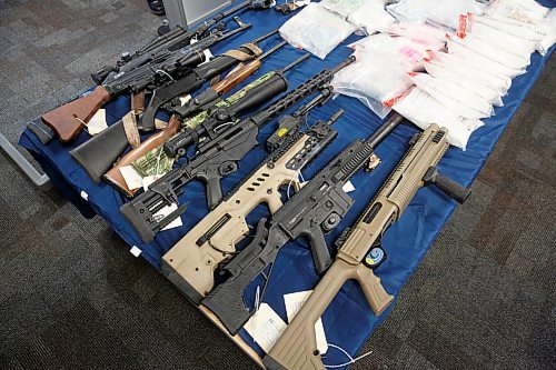 MIKE DEAL / WINNIPEG FREE PRESS
All types of guns were seized during the operation and only some were put out during the press conference.
Winnipeg Police Inspector Elton Hall of the Organized Crime Unit speaks about Operation Phoenix during a press conference at Winnipeg Police Headquarters Thursday morning.
See Erik Pindera story
220113 - Thursday, January 13, 2022.