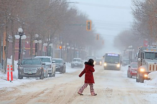 17012021
A pedestrian crosses Rosser Avenue amid flurries on Tuesday morning.   (Tim Smith/The Brandon Sun)