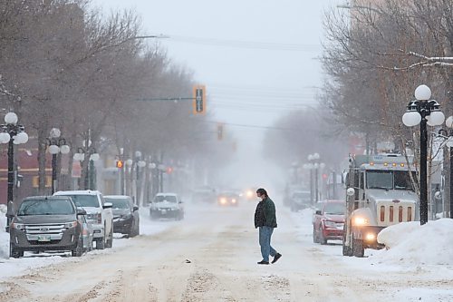17012021
A pedestrian crosses Rosser Avenue amid flurries on Tuesday morning.   (Tim Smith/The Brandon Sun)