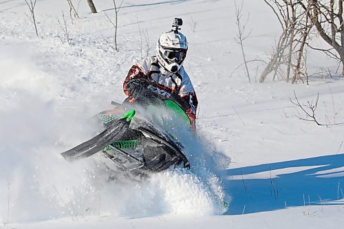 17012021
Luke McNabb plays in the deep snow near his home outside Minnedosa on his snowmobile on a blustery Tuesday afternoon.   (Tim Smith/The Brandon Sun)