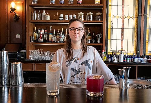 JESSICA LEE / WINNIPEG FREE PRESS

Callan Anderson, a bartender, poses with the drinks she made on January 20, 2022 at Patent 5. On the left is the &#x201c;Young Grasshopper&#x201d; and on the right is the &#x201c;Violet Beauregard&#x201d;.

Reporter: Declan





