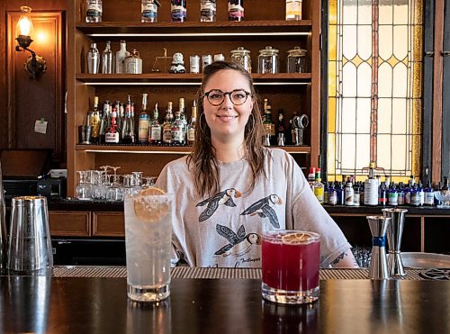 JESSICA LEE / WINNIPEG FREE PRESS

Callan Anderson, a bartender, poses with the drinks she made on January 20, 2022 at Patent 5. On the left is the &#x201c;Young Grasshopper&#x201d; and on the right is the &#x201c;Violet Beauregard&#x201d;.

Reporter: Declan




