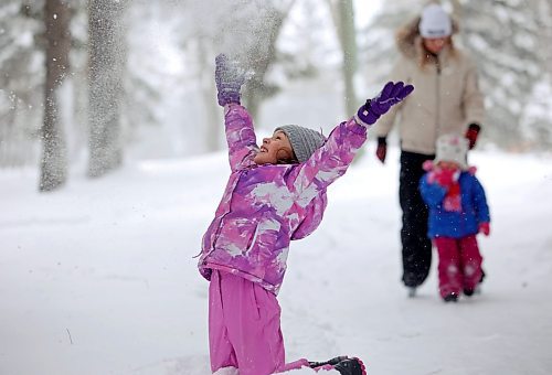 21012022
Quinn Holigroski, 7, plays in the snow while having fun with family at the skating rink in Wasagaming on a mild Friday afternoon. (Tim Smith/The Brandon Sun)