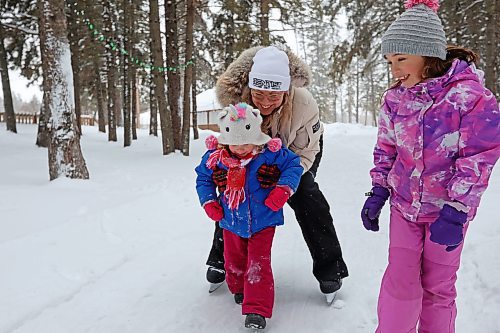 21012022
Bronwyn Holigroski skates along the trail at the skating rink in Wasagaming with her daughters Riley, 3, and Quinn, 7, on a mild Friday afternoon. (Tim Smith/The Brandon Sun)