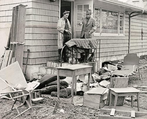 WINNIPEG FREE PRESS ARCHIVES

Flood damage:
Two Winnipeggers ruefully examine the junk that used to be prized household furnishings before the flood waters inundated many sections of Greater Winnipeg in the spring of 1950. The high water mark reached by the Red River can be seen on the windows and walls of this house in the residential district known as Wildwood.