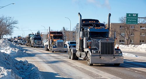 MIKE DEAL / WINNIPEG FREE PRESS
A convoy of trucks makes its way east along Portage Avenue protesting all pandemic mandates slowing down traffic early Monday afternoon.
220124 - Monday, January 24, 2022.