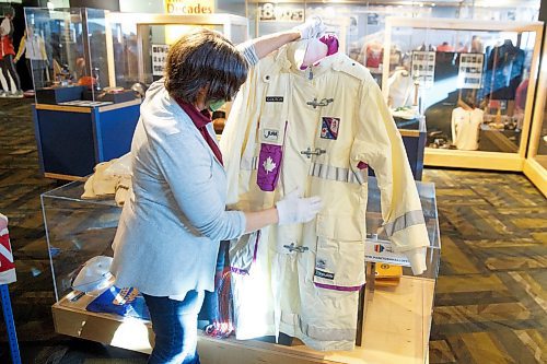 MIKE DEAL / WINNIPEG FREE PRESS
Andrea Reichert, curator at the Manitoba Sports Hall of Fame &amp; Museum, with artifacts from previous winter Olympics.
A jacket worn by an athlete to the 1992 Winter Olympics.
See Brenda Suderman story
220125 - Tuesday, January 25, 2022.