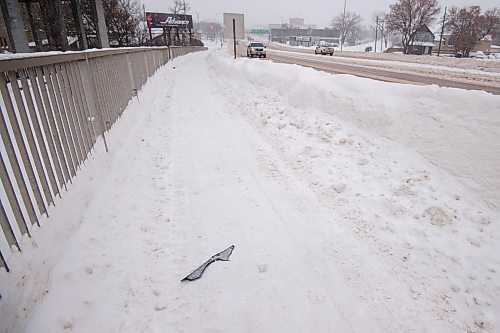 Mike Sudoma / Winnipeg Free Press
A piece of plastic debris lays on the sidewalk side of the Disraeli bridge in downtown Winnipeg Wednesday afternoon
January 25, 2022