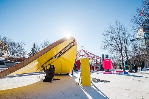 MIKAELA MACKENZIE / WINNIPEG FREE PRESS

Tom Gharagyozyan, with Sputnik Architecture, assembles Sunset (one of the 2022 warming huts) at The Forks in Winnipeg on Thursday, Jan. 27, 2022. Standup.
Winnipeg Free Press 2022.