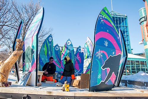 MIKAELA MACKENZIE / WINNIPEG FREE PRESS

Mike Wesner, carpentry instructor (left), and Jennifer Bighetty, Frontier School Division student, assemble Blossom, the 2022 warming hut designed by students in the Engaged Learners program at Frontier School Division, at The Forks in Winnipeg on Thursday, Jan. 27, 2022. Standup.
Winnipeg Free Press 2022.