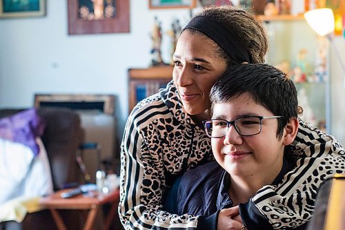 MIKAELA MACKENZIE / WINNIPEG FREE PRESS

Desiree Scott and her 11-year-old brother, DeeJay Sinclair, pose for a portrait in their home in Winnipeg on Thursday, Jan. 27, 2022.  For Mike Sawatzky story.
Winnipeg Free Press 2022.