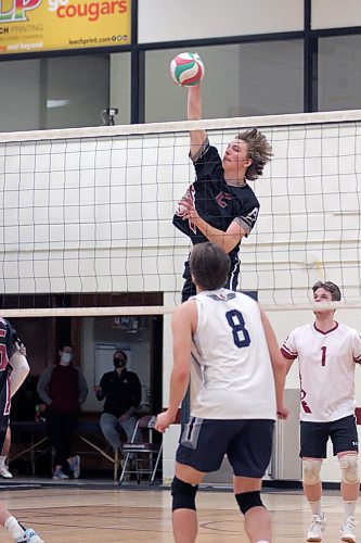 Assiniboine Cougars Carter Beattie attacks against the Providence Pilots during their Manitoba Colleges Athletic Conference men's volleyball match at ACC on Friday. (Thomas Friesen/The Brandon Sun)