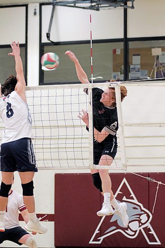 Assiniboine Cougars Nolan Slate attacks against the Providence Pilots during their Manitoba Colleges Athletic Conference men's volleyball match at ACC on Friday. (Thomas Friesen/The Brandon Sun)
