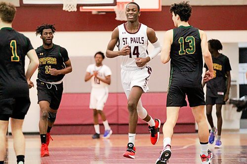 MIKAELA MACKENZIE / WINNIPEG FREE PRESS

St. Paul&#x573; Crusader Ramogi Nyagudi (14) plays in a game against the John Taylor Pipers in Winnipeg on Monday, Jan. 31, 2022.  For Mike Sawatzky story.
Winnipeg Free Press 2022.