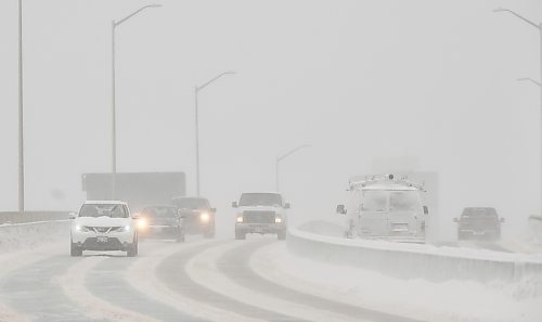 MIKE DEAL / WINNIPEG FREE PRESS
Vehicles driving over the Disraeli Freeway would normally have the downtown skyline raising above them but whiteout conditions from the blizzard Tuesday morning conceal the high-rises.
220201 - Tuesday, February 01, 2022.