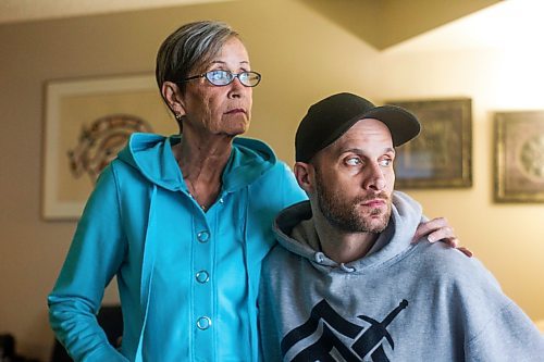 MIKAELA MACKENZIE / WINNIPEG FREE PRESS

Wendy Petrushak and her son, Graeme Mohr, pose for a photo in her condo, which they had to flee because of the Kimberly fire, in Winnipeg on Tuesday, Feb. 1, 2022. For Chris Kitching story.
Winnipeg Free Press 2022.