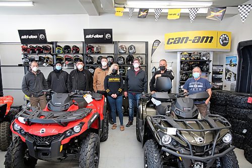 The staff at Brandon powersports business Action Power show off their equipment. (Colin Slark/The Brandon Sun)