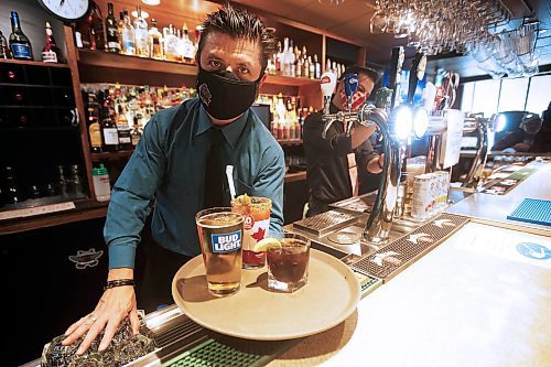 JOHN WOODS / WINNIPEG FREE PRESS
Tony Siwicki, owner of Silver Heights Restaurant and Lounge, serves some drinks in his restaurant in Winnipeg Monday, October 5, 2020. The provincial authorities announced restaurants must stop selling alcohol by 10pm and close by 11pm.

Reporter: Taniguchi
