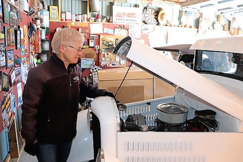 Barb Balanyk checks in on the 350 Chevrolet motor that powers her modified 1934 Ford pickup truck on Wednesday afternoon in Brandon. (Kyle Darbyson/The Brandon Sun)