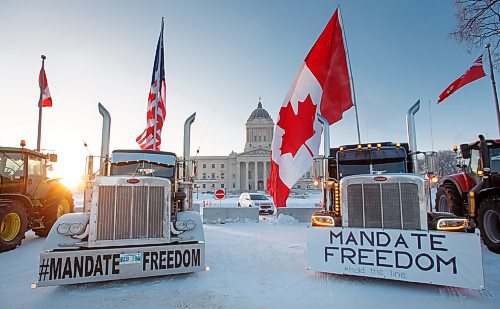 MIKE DEAL / WINNIPEG FREE PRESS
Protesters block the entrance to the Manitoba Legislative building on Broadway Avenue and have parked their trucks along Memorial early Friday morning.
220204 - Friday, February 04, 2022.