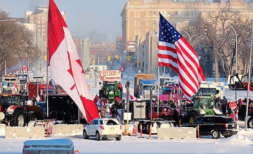 MIKE DEAL / WINNIPEG FREE PRESS
Protesters block the entrance to the Manitoba Legislative building on Broadway Avenue and have parked their trucks along Memorial early Friday morning.
220204 - Friday, February 04, 2022.