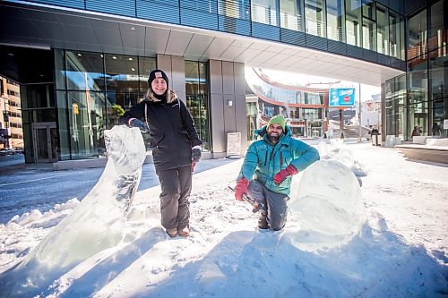 MIKAELA MACKENZIE / WINNIPEG FREE PRESS

Pamela Hardman with the Downtown BIZ and sculptor Peter Hargraves pose for a portrait by an ice sculpture of belugas at True North Square in Winnipeg on Friday, Feb. 4, 2022. For Kevin story.
Winnipeg Free Press 2022.