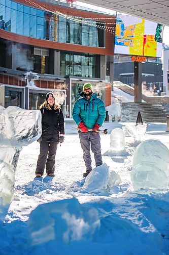 MIKAELA MACKENZIE / WINNIPEG FREE PRESS

Pamela Hardman with the Downtown BIZ and sculptor Peter Hargraves pose for a portrait by an ice sculpture of belugas at True North Square in Winnipeg on Friday, Feb. 4, 2022. For Kevin story.
Winnipeg Free Press 2022.