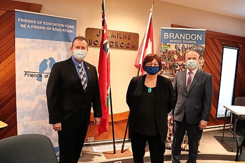 Education Minister Wayne Ewasko poses for a photo with Brandon School Division chairperson Linda Ross and Supt. Mathew Gustafson on Friday afternoon at BSD headquarters, shortly after the Lac Du Bonnet MLA unveiled provincial funding for the 2022-23 school year. (Kyle Darbyson/The Brandon Sun)