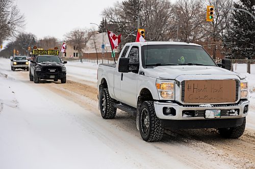 Ralliers participate in a slow-role truck convoy fr freedom in Brandon Saturday. The protest was in support of truckers in Ottawa pushing for the end of COVID-19 related mandates. The group of several dozen vehicles, including semis, departed from the north hill Tim Hortons and ended at the Victoria Inn parking lot &#x2014; it was originally scheduled to drive down to Portage la Prairie but was re-rooted due to poor road conditions. (Chelsea Kemp/The Brandon Sun)