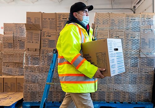 Denny Lathlin organizes eggs for deliveries at the Brandon Neighbourhood Renewal Corporation Inc. Friday. The shipment of more than 200,000 affordably priced eggs was provided by Second Harvest  and co-ordinated by the Food Rescue Grocery Store. The eggs are $3 for a flat of 30 or $10 for a box of 180. The proceeds will cover the shipping, unloading and distribution costs associated with the eggs. They were available for pick-up on Friday and Saturday. (Chelsea Kemp/The Brandon Sun)