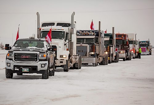 Ralliers participate in a slow-role truck convoy fr freedom in Brandon Saturday. The protest was in support of truckers in Ottawa pushing for the end of COVID-19 related mandates. The group of several dozen vehicles, including semis, departed from the north hill Tim Hortons and ended at the Victoria Inn parking lot &#x460;it was originally scheduled to drive down to Portage la Prairie but was re-rooted due to poor road conditions. (Chelsea Kemp/The Brandon Sun)