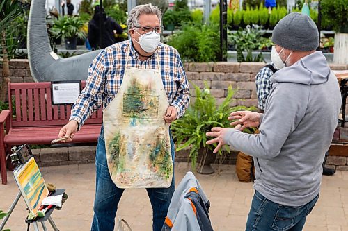 Roger Conrad, left, and Stephen Wiens of The Artist Heart Friends host a painting demonstration at the Green Spot Home and Garden Saturday. The group of artists will be hosting demonstrations at the garden centre the third Saturday of each month. (Chelsea Kemp/The Brandon Sun)