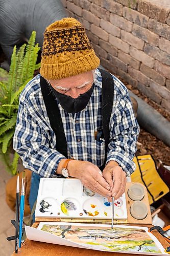 Painter Douglas Brolund creates a painting of the Green Spot Home and Garden oasis Saturday. The Artist Heart Friends will be hosting demonstrations at the garden centre the third Saturday of each month. (Chelsea Kemp/The Brandon Sun)