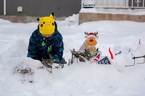 Sylas Arnold, 9, plays in a fort he built with his friends Saturday. (Chelsea Kemp/The Brandon Sun)