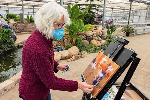 Linda Tame, of the Artist Heart Friends, hosts a painting demonstration at the Green Spot Home and Garden Saturday. The group of artists will be hosting demonstrations at the garden centre the third Saturday of each month. (Chelsea Kemp/The Brandon Sun)