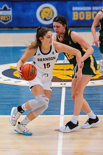 Adrianna Proulx of the Brandon University Bobcats guards the ball against the University of Regina Cougars Jade Belmore in a Canada West women&#x573; basketball game at the Healthy Living Centre Friday. (Chelsea Kemp/The Brandon Sun)
