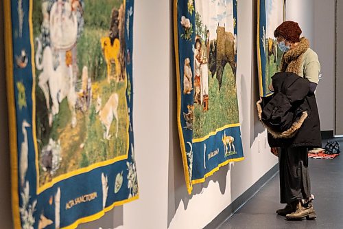 Guests explore the Art Gallery of Southwest Manitoba Thursday during the opening of artist Mary Anne Barkhouse&#x573; exhibit opimihaw. (Chelsea Kemp/The Brandon Sun)