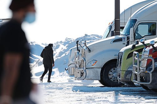 JOHN WOODS / WINNIPEG FREE PRESS
Working drivers head to their trucks at a truck stop on Portage Avenue in Headingley, Sunday, February 6, 2022. 

Re: Piche