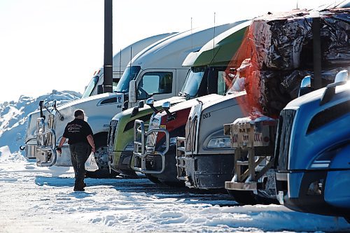 JOHN WOODS / WINNIPEG FREE PRESS
A working driver heads to his truck at a truck stop on Portage Avenue in Headingley, Sunday, February 6, 2022. 

Re: Piche