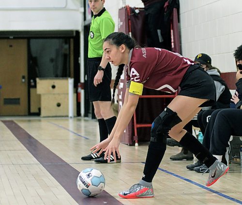 Assiniboine Community College Cougars Hannah Yuen places the ball for a kick-in against the Brandon University Bobcats during their Manitoba Colleges Athletic Conference women's futsal game at ACC on Sunday. (Thomas Friesen/The Brandon Sun)