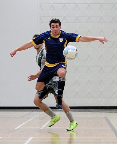 Brandon University Bobcats Sam Wetstein jumps to play the ball against Canadian Mennonite University during their Manitoba Colleges Athletic Conference men's futsal game at Henry Champ Gymnasium on Sunday. (Thomas Friesen/The Brandon Sun)