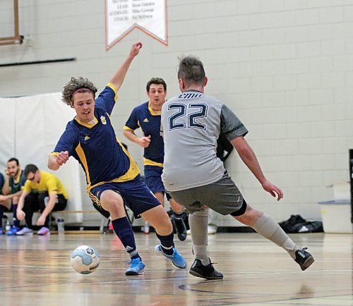 Brandon University Bobcats Zach Wood dribbles against Canadian Mennonite University's Will Anderson during their Manitoba Colleges Athletic Conference men's futsal game at Henry Champ Gymnasium on Sunday. (Thomas Friesen/The Brandon Sun)