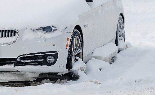 JOHN WOODS / WINNIPEG FREE PRESS
A car that was frozen in place due to a waterman break on Fulton Street Sunday, February 6, 2022. Crews were called to work on fixing a watermain break on a resident&#x573; property. Residents allege water had been flowing uncontrolled for a week.

Re: Piche