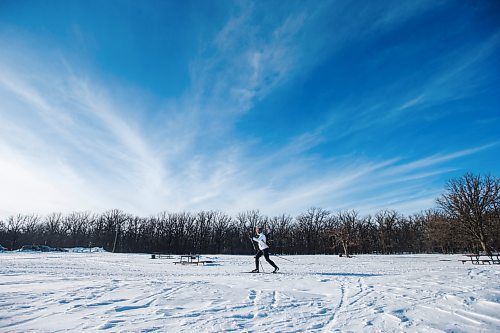 MIKAELA MACKENZIE / WINNIPEG FREE PRESS

Carol Antrobus enjoys the warm weather while cross-country skiing (for the first time on a new pair of skis) at Beaudry Provincial Park just outside of Winnipeg on Monday, Feb. 7, 2022. Entry to provincial parks is free all of February. Standup.
Winnipeg Free Press 2022.