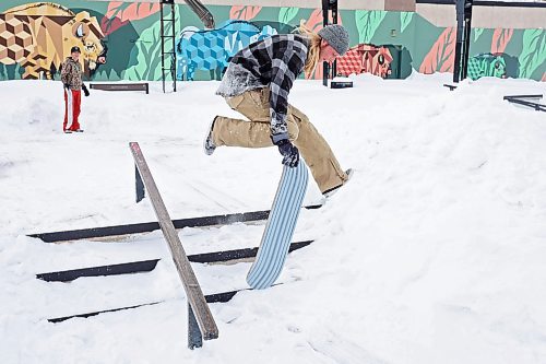 07022021
Tanner Kitson of Rapid City does a trick down a set of stairs at the Kristopher Campbell Memorial Skatepark in Brandon while snow-skating with his brother Quintin on a mild Monday. (Tim Smith/The Brandon Sun)