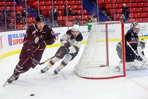 08022022
Brett Hyland #7 of the Brandon Wheat Kings chases the puck and Hunter Mayo #5 of the Red Deer Rebelsaround the Rebels net during WHL action at Westoba Place on Tuesday evening. (Tim Smith/The Brandon Sun)