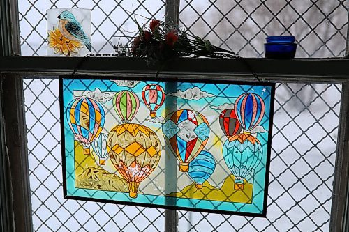 09022022
A stained-glass picture hangs in the window of the barber shop at the back of the Clanwilliam General Store. (Tim Smith/The Brandon Sun)